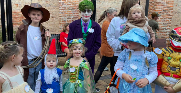 Kids dressed for Halloween getting treat in the streets in Dublin GA