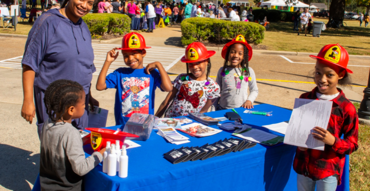 Smiling kids learn about fire safety at VA - Exuberant April Events